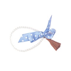 Pulsera de perlas Swarosvky, lazo azul y pompón marrón (col. Med.) de Mara García